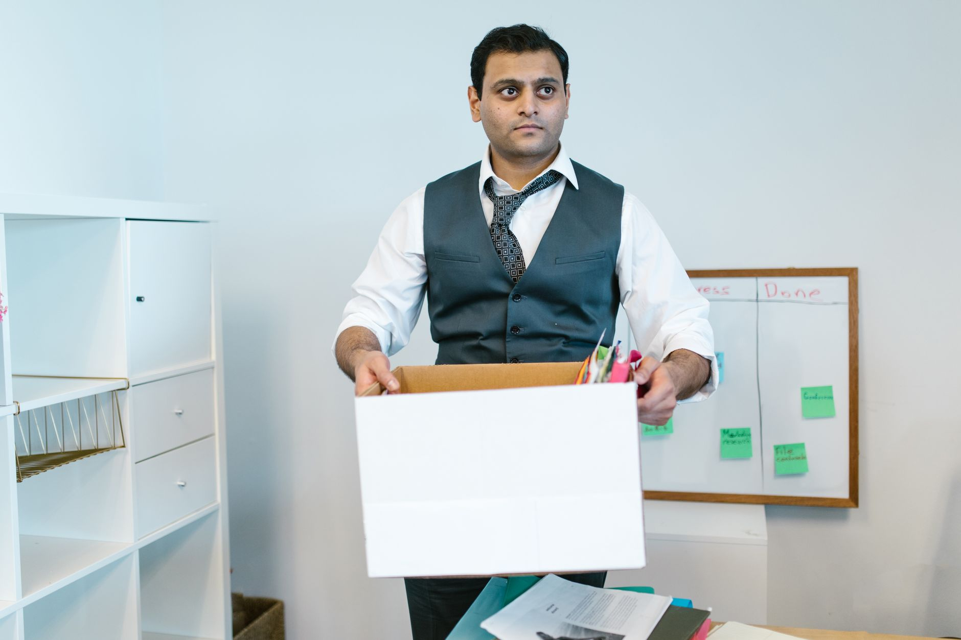 man carrying a white box
